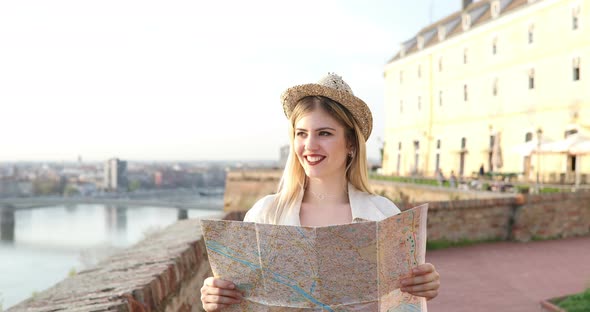 Beautiful Woman Traveling and Sightseeingwith Map in Hand