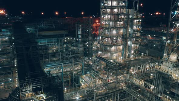 Illuminated Constructions of the Oil Refinery at Night alt