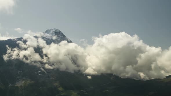 Time Lapse Clouds Float under Legendary North Face of Mountain Eiger in the Swiss Alps