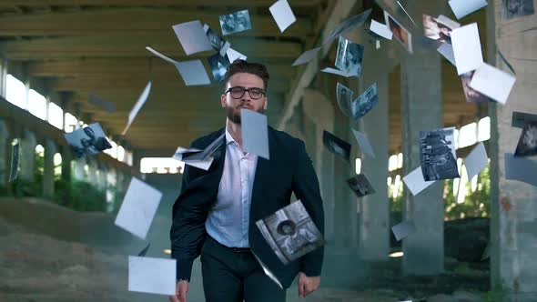 A successful man in a jacket runs in slow motion and old photos are flying in the background	 alt