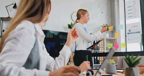 female team sharing ideas in joint business strategy during meeting in modern boardroom alt