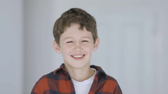 Cute little boy laughing heartily alt
