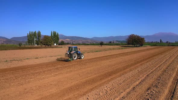 Tractor is Plowing the Farm