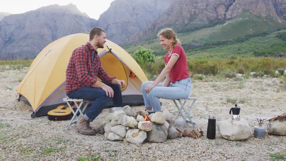 Caucasian couple camping in nature alt