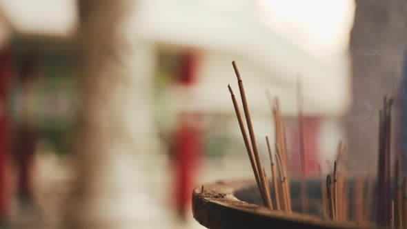 Incense Sticks Burning In Urn alt
