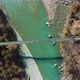 Aerial 90 Degree View of man walking on bridge over Bhagirathi river - VideoHive Item for Sale