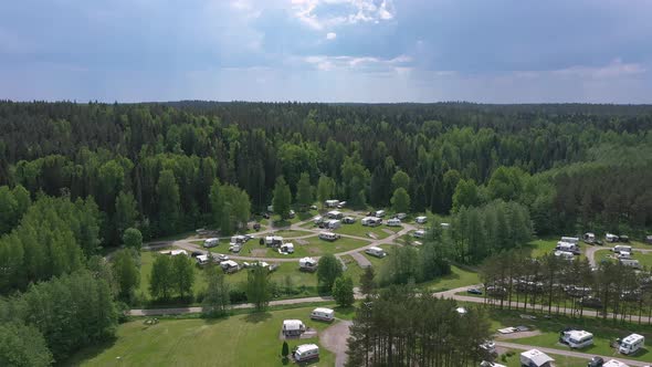 Awesome Drone Shot of a Trailer Park Surrounded By a Forest alt