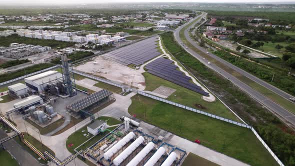 Aerial View Of CEPM Electric Utility Company With Field Of Photovoltaic Solar Panels In Punta Cana. alt