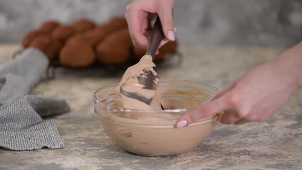 Mixing Chocolate Cream in Glass Bowl.. alt