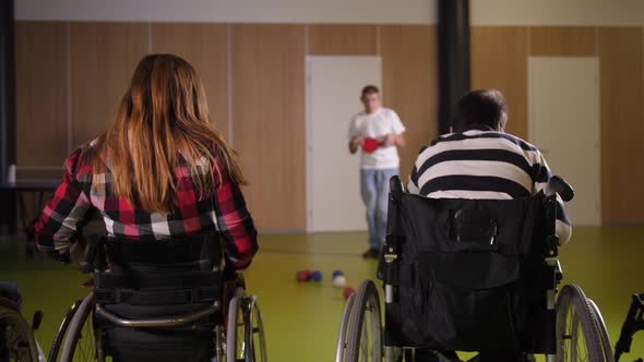 Two Boccia Players in Wheelchairs During Game alt