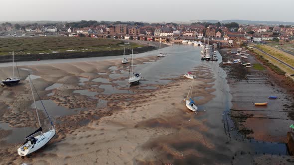 Aerial Drone View panning Out, Wells-Next-The-Sea Tidal Harbour At Low Tide, Sunrise