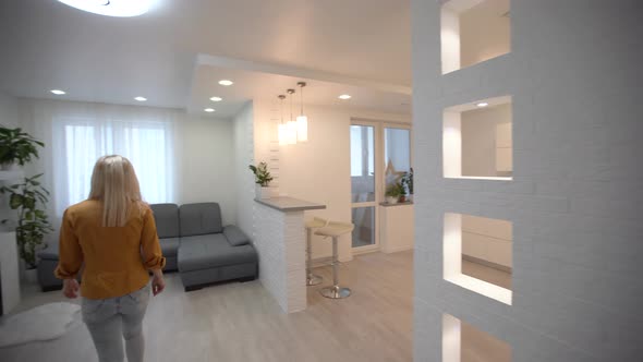 Moving in New Apartment Woman with Keys Walks Into Her New Flat Empty White Rooms New Home alt