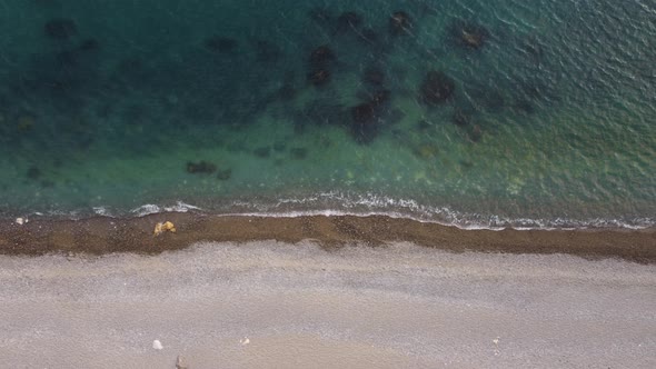 Aerial View From Above on Azure Sea and Pebbles Beach alt