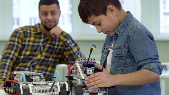 Boy Playing with Toy Car alt