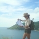 Woman With Backpack Monitoring Tourist Map In Hand - VideoHive Item for Sale