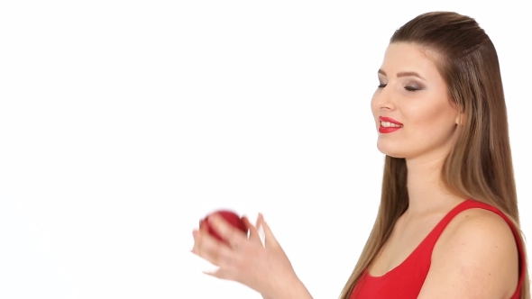 Woman Holding Red Apple and Smiling on White Background