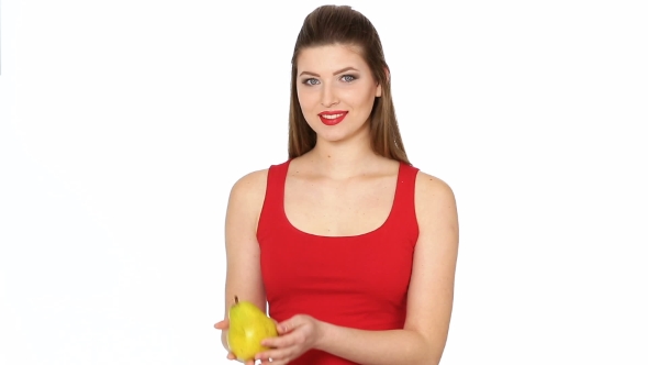 Woman with Red Lips Holding Juicy Pear and Smilin