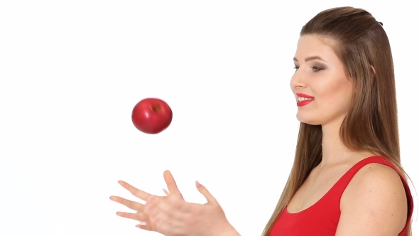 Woman Holding Red Apple and Smiling on White Background
