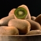 Kiwi in Wooden Bowl on Black Background - VideoHive Item for Sale