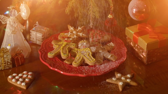 Christmas Concept with Gingerbread Man Cookie on Red Plate