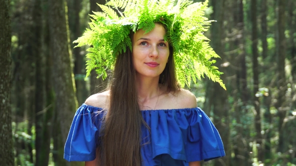 Portrait of a Girl with a Wreath on His Head. Beautiful White Girl with Freckles, a Wreath of Fern