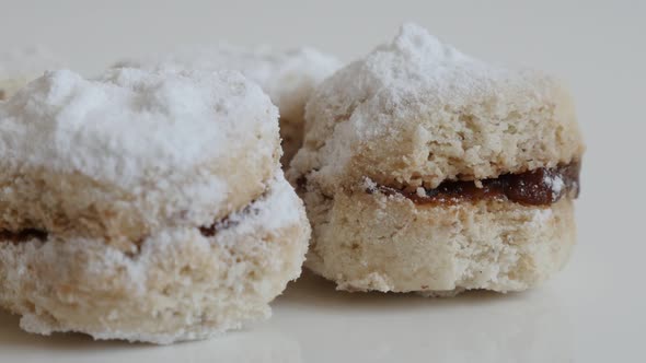 Tasty dessert filled with marmalade called little vanilla cookie 4K 2160p 30fps UltraHD tilting foot alt