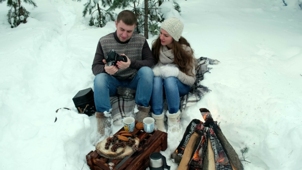 Guy and Girl Photographed in Winter Forest