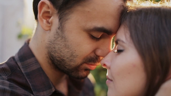 Man and Woman Hugging in City