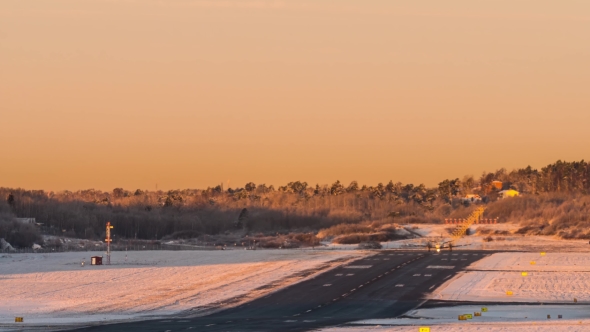 Airplanes Taking Off One By One at the Winter Dawn. Sweden