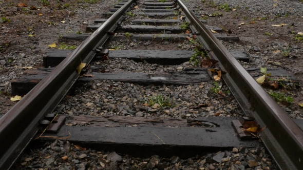 Woman Steps on the Straight Railway Track. alt