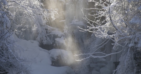 Frozen Waterfall and Rays of Sun