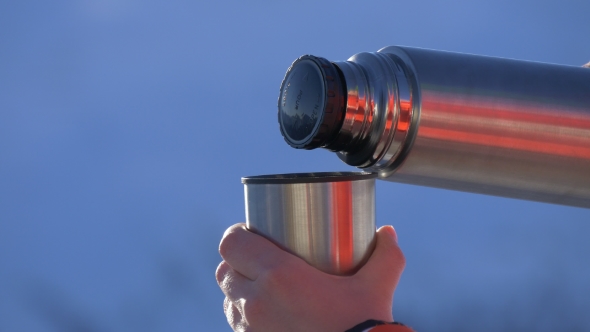 Pouring Tea From a Thermos
