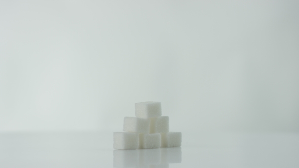 Cubes of Sugar at the White Background