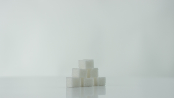Cubes of Sugar at the White Background alt