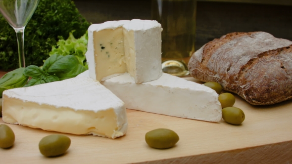 Wine in the Glass Next To the French Brie Cheese alt