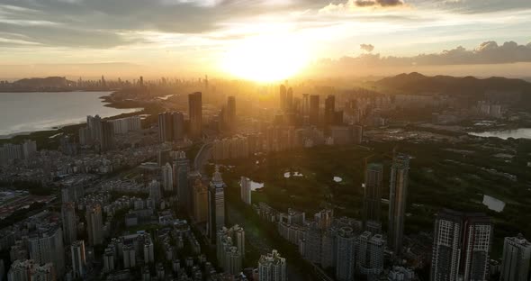 Aerial footage of beautiful landscape at sunset in shenzhen city, China alt