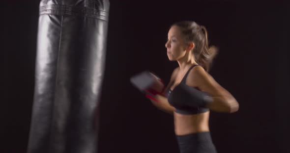 Athletic Woman Boxing Punching-Bag alt