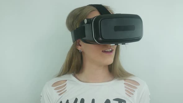 Young Sexy Woman Uses A Virtual Reality Helmet