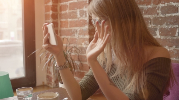 Woman Having Video Conversation Using Smartphone