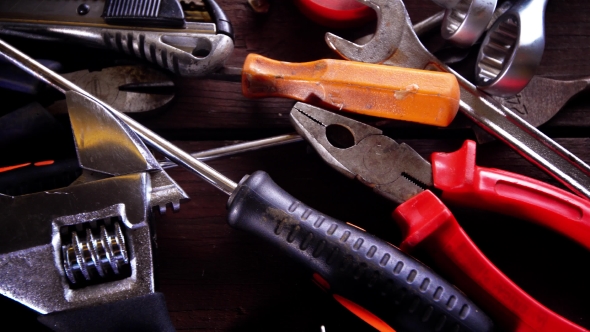 Many Old Rusty Tools on Repairman Desk