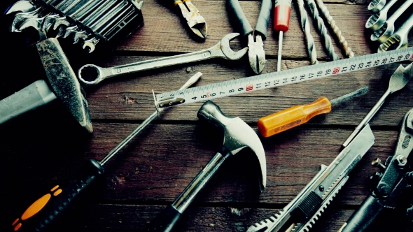 Many Old Rusty Tools on Repairman Desk