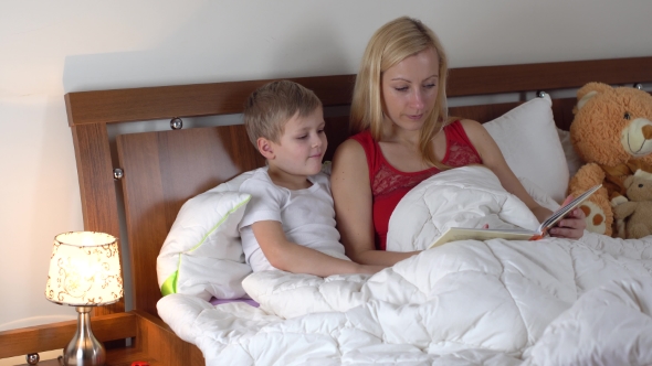 Mom with Kid Reading Book