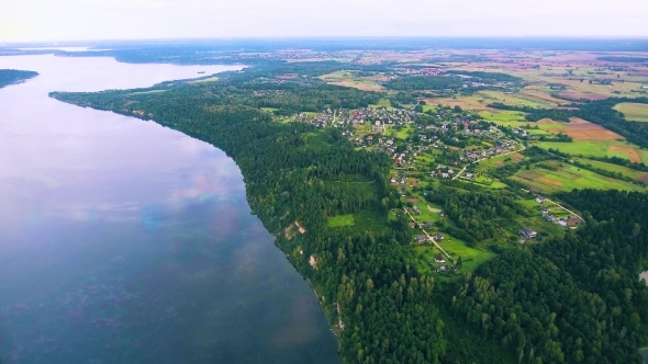 Flying Above Foggy Lake Early in the Morning