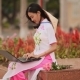 The Beautiful Asian Girl Speaks on a Laptop on the Street and a Beautiful National Dress Ao Dai with - VideoHive Item for Sale