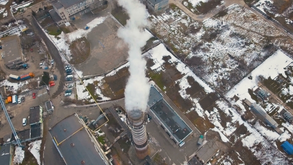 Top of the Pipe with Steam During the Winter Heating Season (Aerial Shot) alt