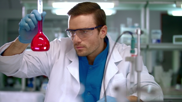 Scientist Checking Test Tube with Pink Liquid. Laboratory Researcher ...