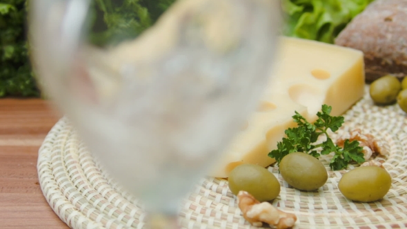 Maasdam Cheese with White Wine, Olives and Nuts alt