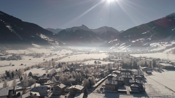 Flying Over the Snow-covered Austrian Village