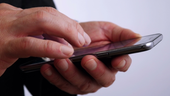 Businessman Reading on Mobile Phone