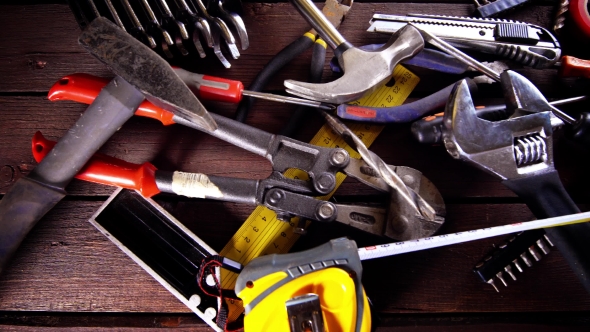 Many Old Rusty Tools on Repairman Desk